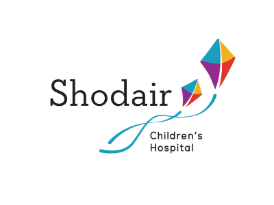 Shodair Children’s Hospital logo with the word 'Shodair' and a blue curved line forming two colorful kite shapes above.